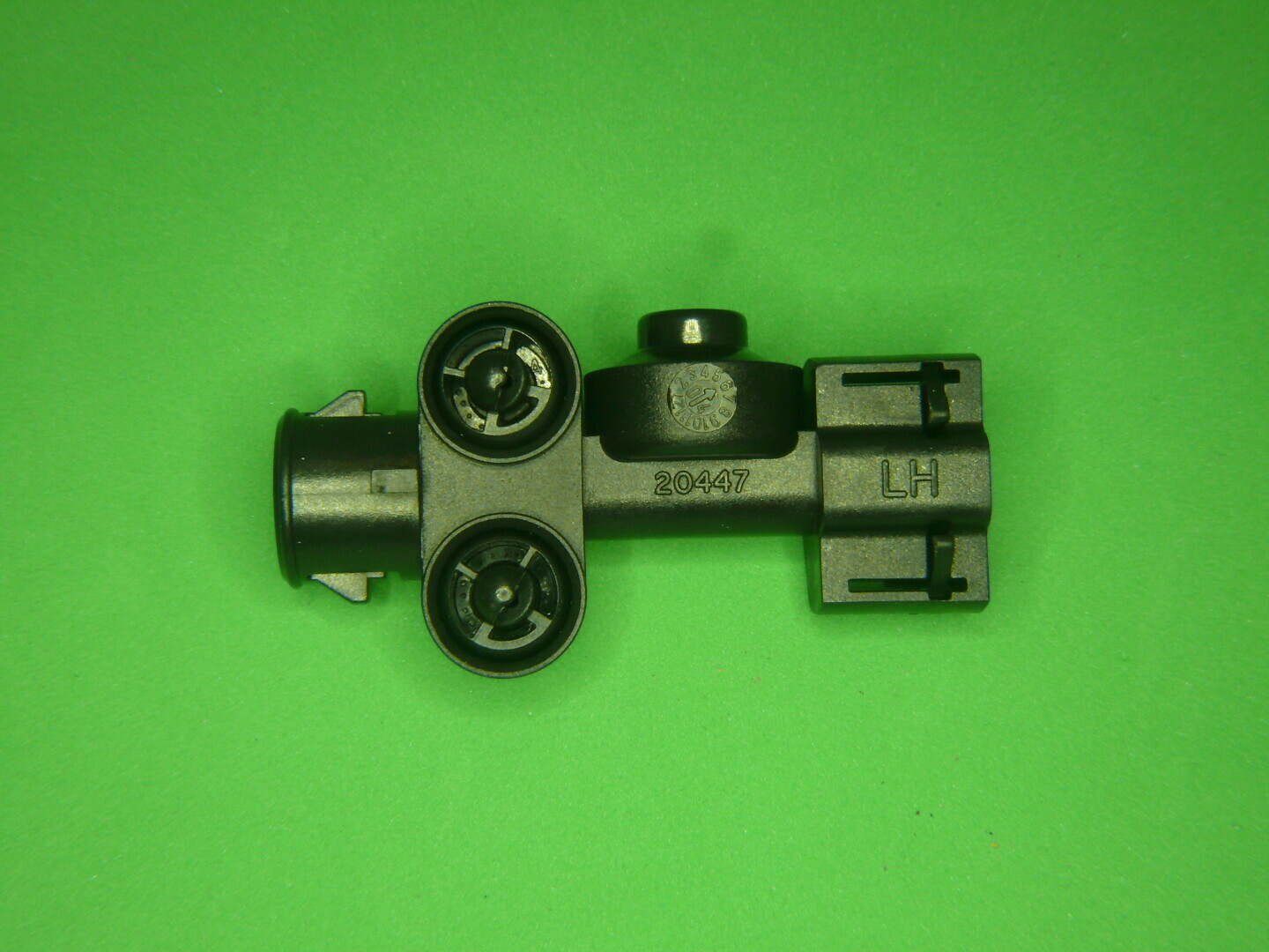 Koplampsproeier kop links